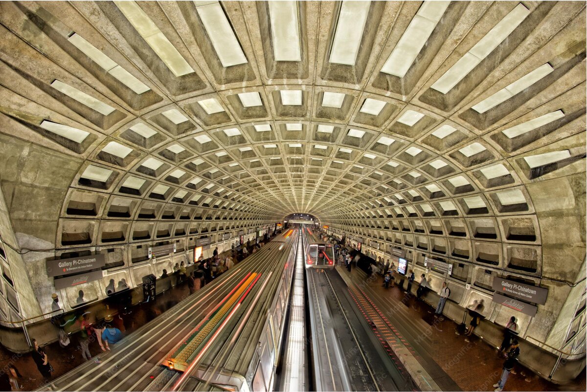 Commuters and trains at the Gallery Place-Chinatown Metro station in Washington, DC